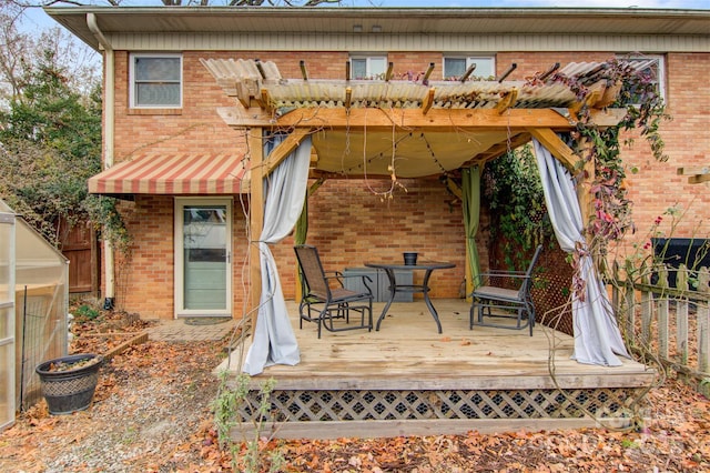 back of house with a wooden deck