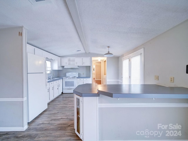 kitchen with white appliances, dark wood-type flooring, white cabinets, lofted ceiling with beams, and kitchen peninsula