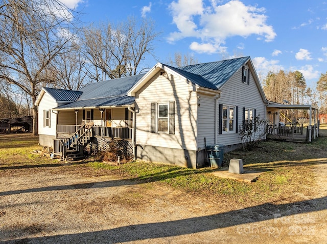 view of side of property featuring a porch