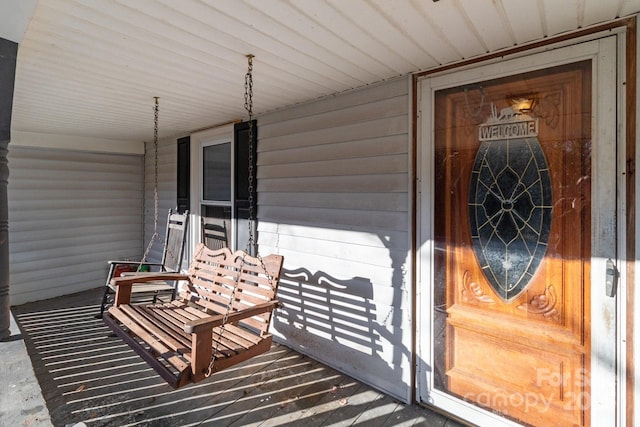 entrance to property featuring a porch