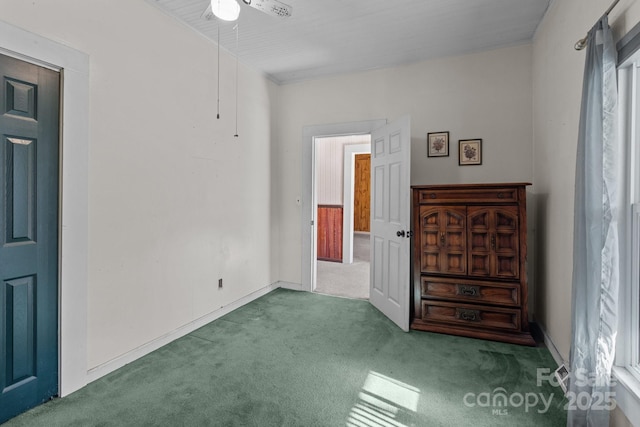 empty room featuring carpet and ceiling fan