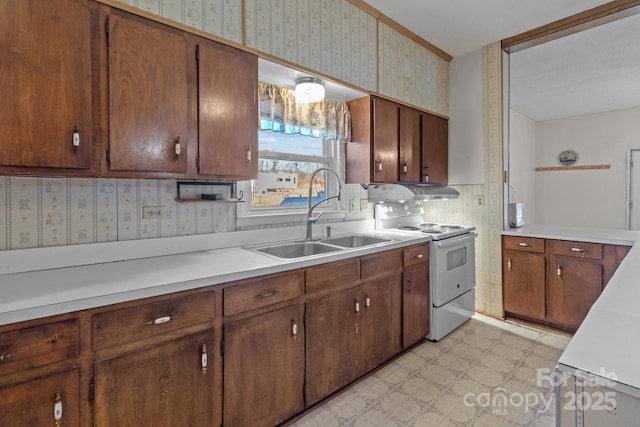 kitchen with white electric range oven and sink