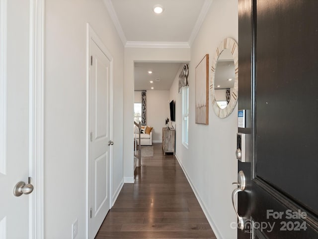 hall featuring dark hardwood / wood-style flooring and ornamental molding