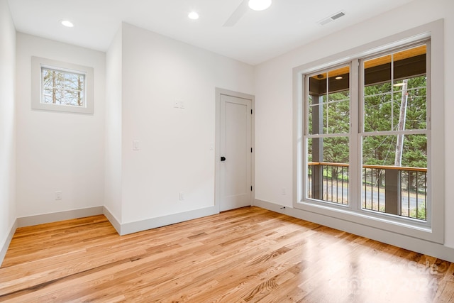 unfurnished room featuring light hardwood / wood-style flooring and ceiling fan