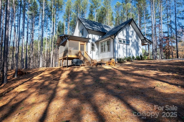 rear view of property with a sunroom