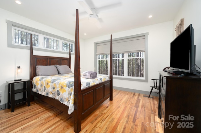 bedroom featuring ceiling fan and light wood-type flooring