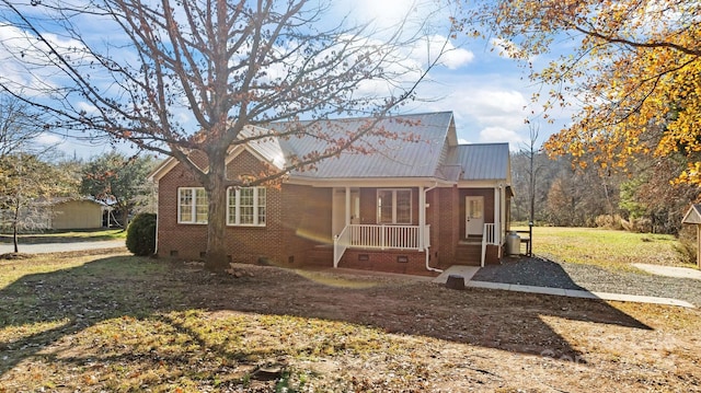 exterior space with a lawn and a porch