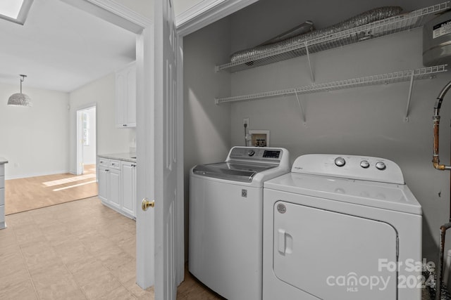 laundry area with washing machine and clothes dryer