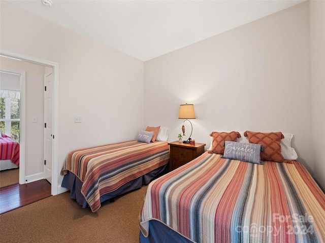 bedroom with wood-type flooring