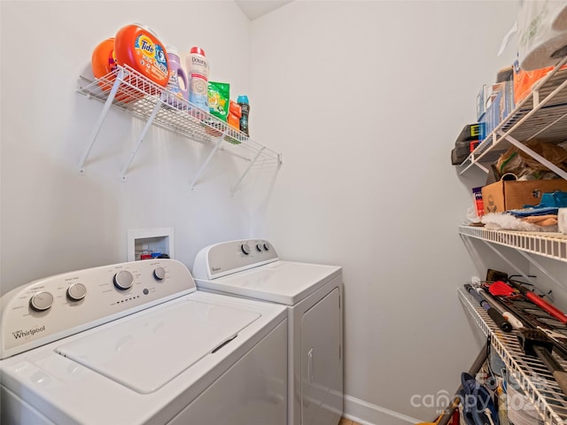 laundry room with independent washer and dryer