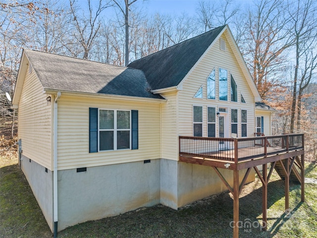 view of side of home featuring a wooden deck