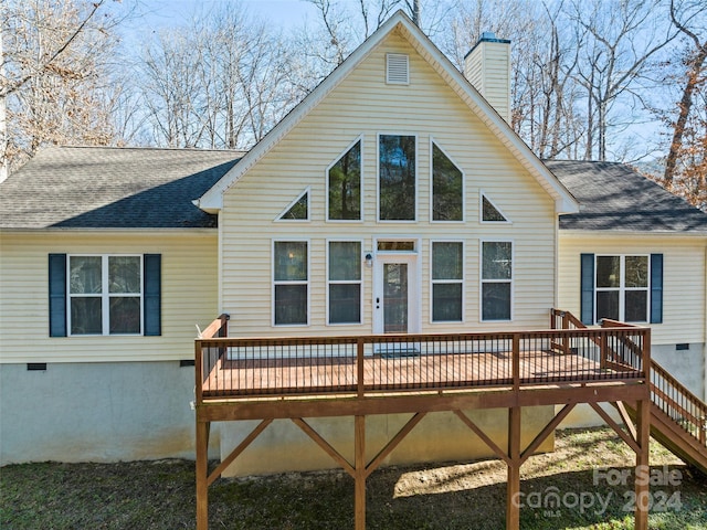 back of house featuring a wooden deck