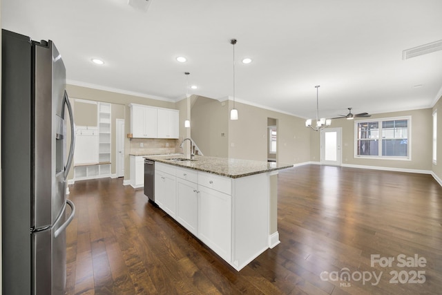 kitchen featuring white cabinets, ceiling fan, an island with sink, appliances with stainless steel finishes, and stone countertops