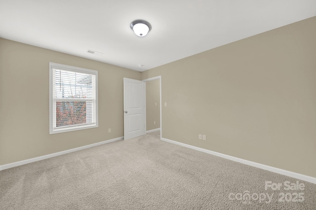 spare room featuring carpet flooring