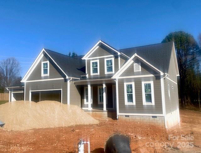 craftsman house with a porch and crawl space