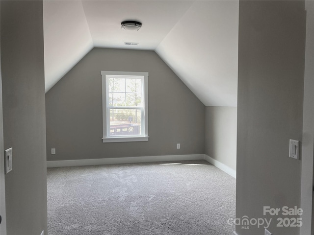 bonus room featuring carpet flooring, vaulted ceiling, visible vents, and baseboards