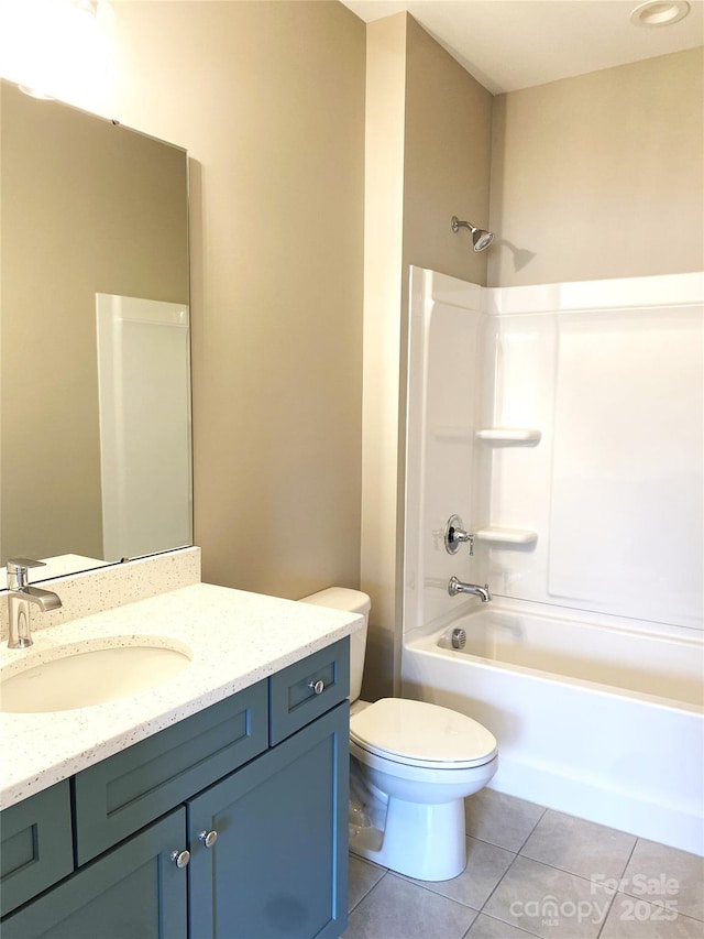 full bathroom featuring  shower combination, vanity, tile patterned flooring, and toilet