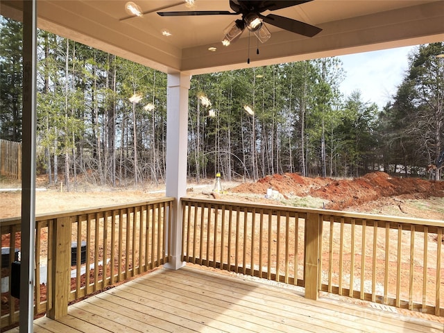 wooden terrace featuring ceiling fan