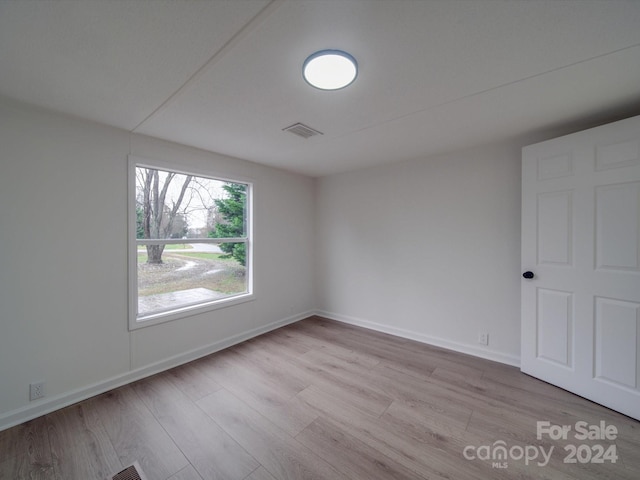 unfurnished room featuring light wood-type flooring