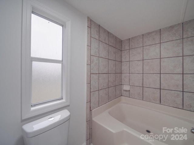 bathroom with a bathtub and toilet