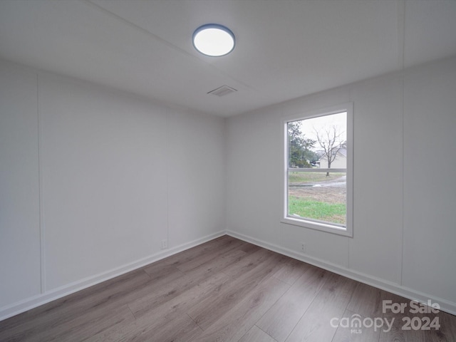 spare room featuring light wood-type flooring