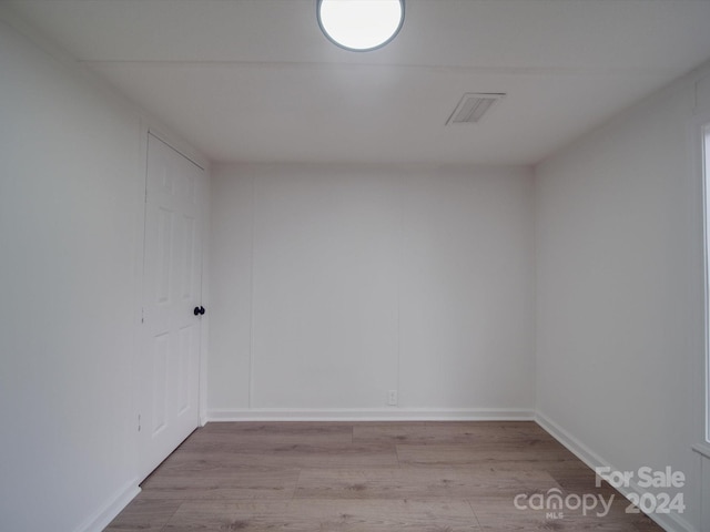 spare room featuring light hardwood / wood-style flooring