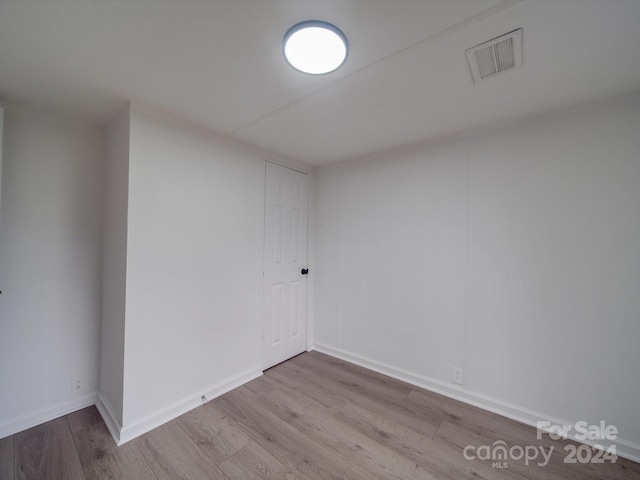 unfurnished room with light hardwood / wood-style flooring