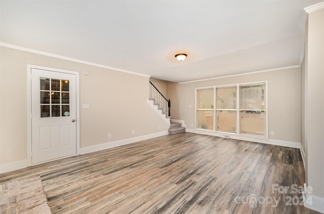 unfurnished room featuring hardwood / wood-style flooring and crown molding