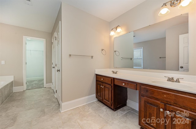 bathroom with vanity and a bathtub