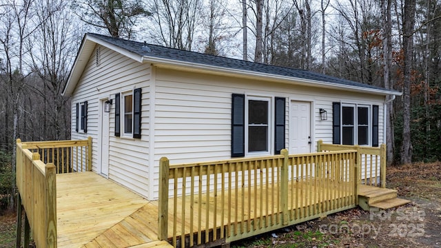 view of front of home with a wooden deck