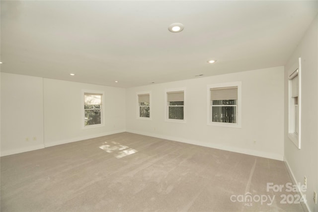 empty room with light colored carpet