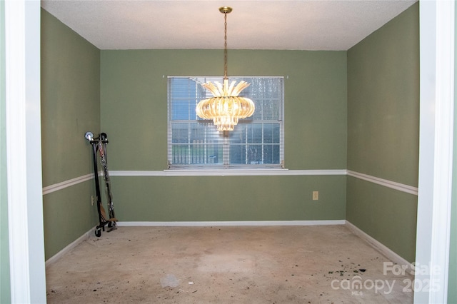 unfurnished dining area with a notable chandelier