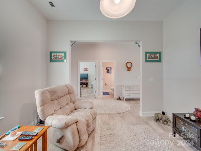 sitting room with light hardwood / wood-style floors