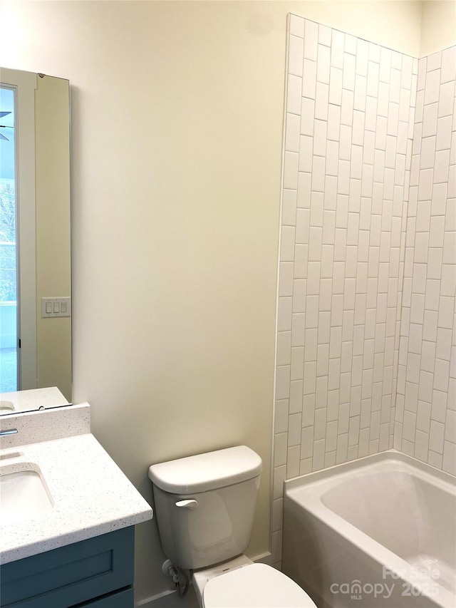 bathroom featuring shower / washtub combination, vanity, and toilet