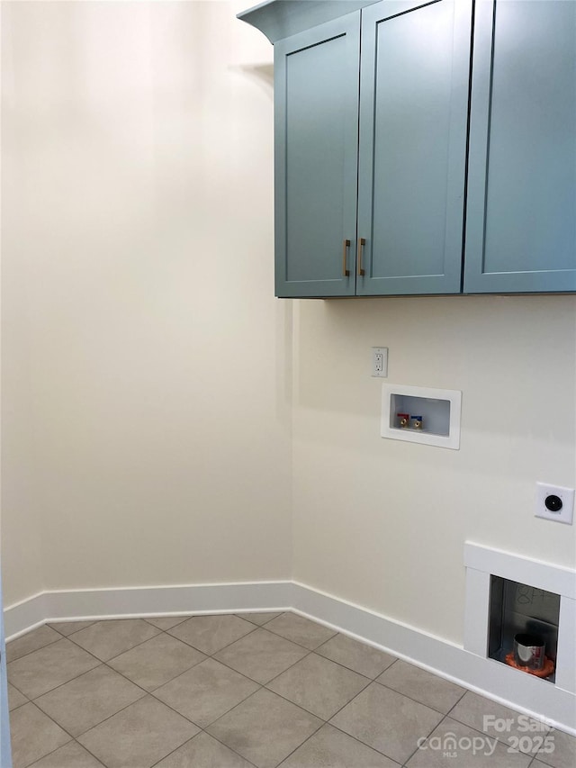 laundry room with cabinet space, light tile patterned floors, baseboards, hookup for a washing machine, and hookup for an electric dryer