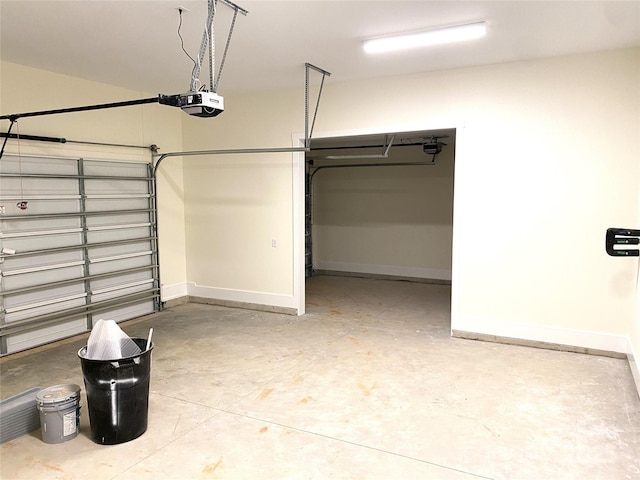 garage with baseboards and a garage door opener