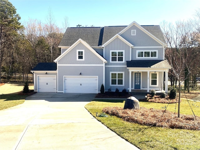 view of front facade featuring board and batten siding, a front lawn, a porch, driveway, and an attached garage