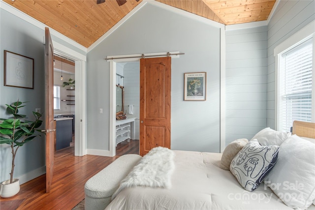 bedroom featuring a barn door, wooden ceiling, and lofted ceiling