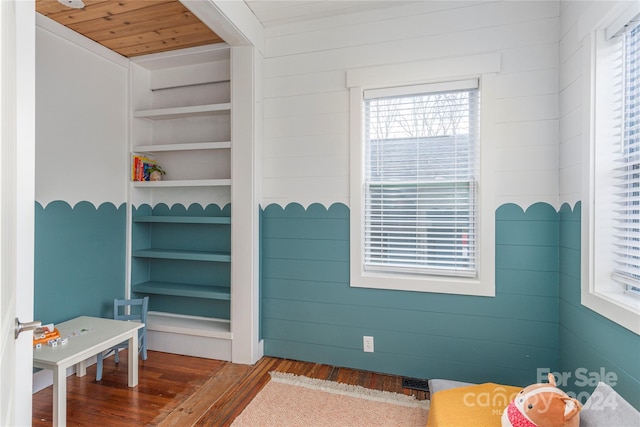 interior space featuring hardwood / wood-style floors and wood ceiling