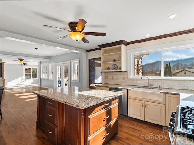 kitchen with dark wood-type flooring, sink, stainless steel dishwasher, decorative backsplash, and light stone countertops