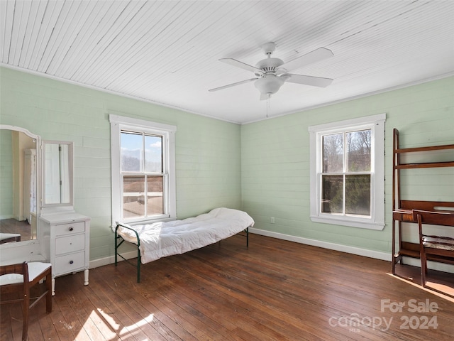 bedroom with ceiling fan and dark wood-type flooring