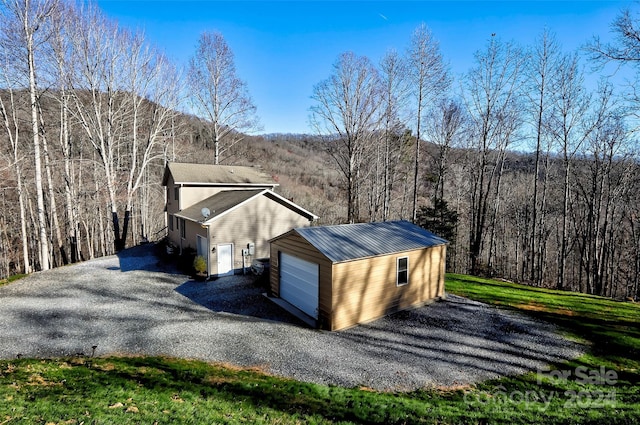 exterior space featuring a yard and a garage