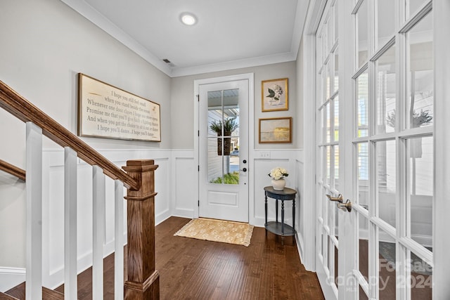 entryway with crown molding and dark wood-type flooring