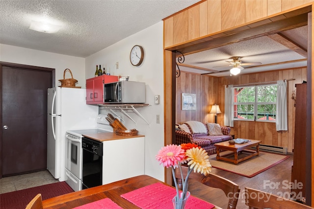 kitchen featuring ceiling fan, hardwood / wood-style floors, white electric range oven, and a textured ceiling