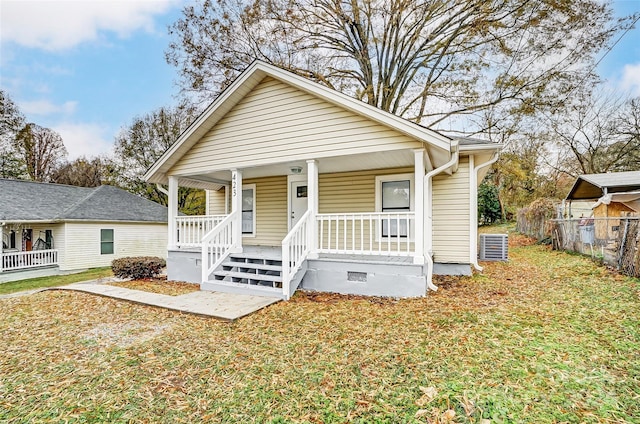 bungalow-style house with a porch and a front yard