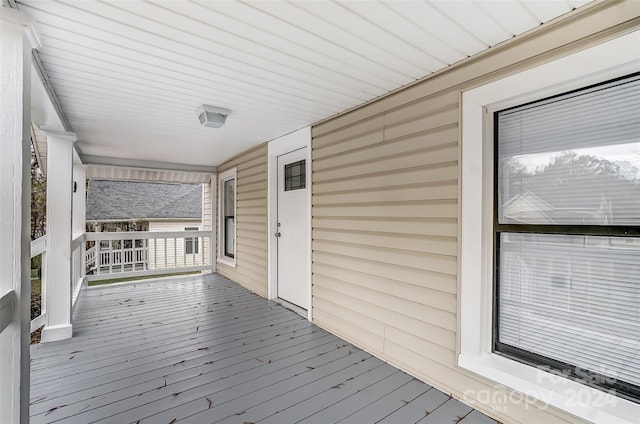 wooden deck featuring covered porch