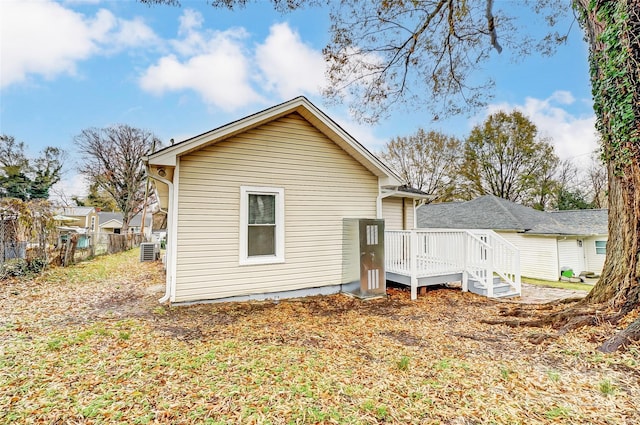 back of property with a wooden deck