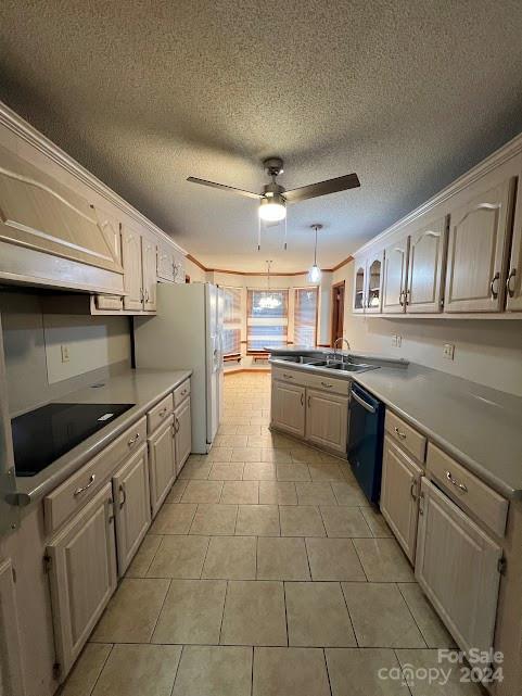 kitchen with kitchen peninsula, ceiling fan, black appliances, and a textured ceiling