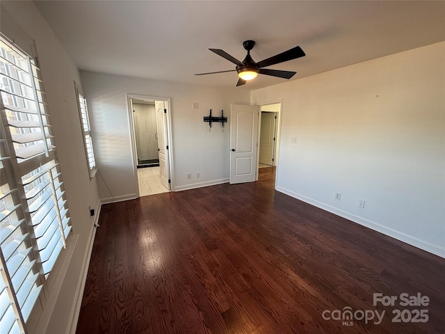 unfurnished room featuring wood finished floors, a ceiling fan, and baseboards