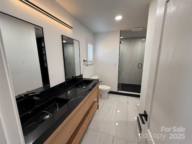 bathroom with a marble finish shower, marble finish floor, vanity, and toilet